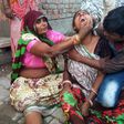 A woman cries after a wall collapsed during a wedding, killing at least 24 people, in Bharatpur, in India's Rajasthan state, on May 11, 2017