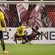 Guangzhou Evergrande's midfielder Paulinho scores a goal past Kashima Antlers' defender Naomichi Ueda during the AFC Champions League football match between Japan's Kashima Antlers and China's Guangzhou Evergrande on May 30, 2017