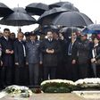 Lebanese Prime Minister Saad Hariri (C) prays over the tomb of his father, slain former prime minister Rafiq Hariri, in Beirut on February 14, 2017