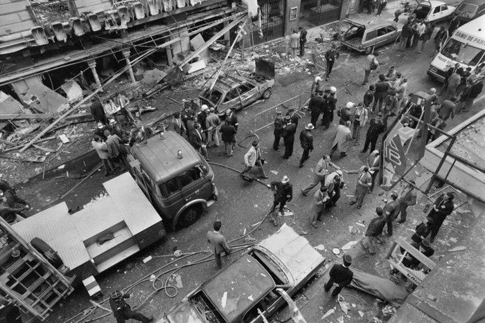 Police examine the site of a car bomb in the Rue Marbeuf, Paris, in April, 1982 attributed to "Carlos the Jackal," a Venezuelan named Ilyich Ramirez Sanchez