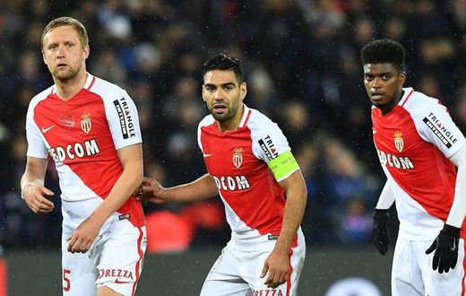 (from L) Monaco's Kamil Glik, Radamel Falcao and Jemerson keep their eye on the ball during the match against Paris Saint-Germain in Paris on January 29, 2017