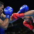 France's Tony Yoka (red) fights against Britain's Joe Joyce (blue) in the men's super heavy (+91kg) final bout at the Rio Games on August 21, 2016