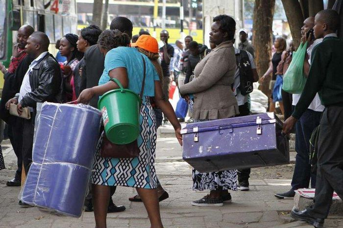 A Form 1 student being escorted to school (Twitter)