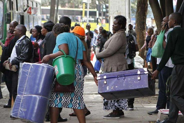 A Form 1 student being escorted to school (Twitter)