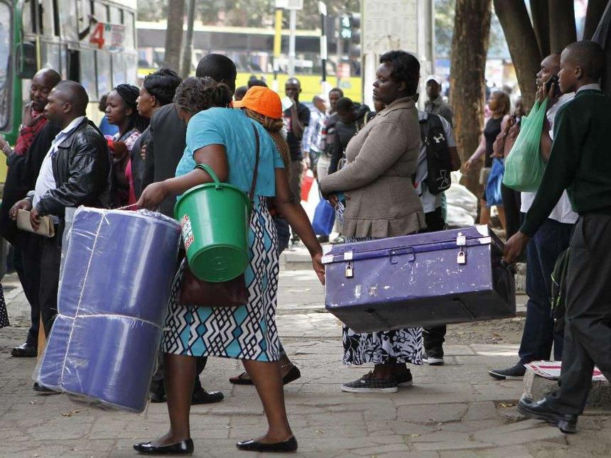 A Form 1 student being escorted to school (Twitter)