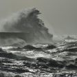 Waves crash over Newhaven Lighthouse on the south coast of England on February 23, 2017 as Storm Doris hits the country