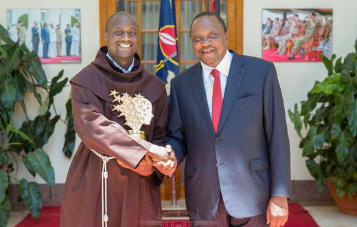 President Kenyatta with teacher Peter Tabichi