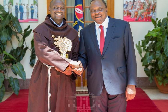 President Kenyatta with teacher Peter Tabichi