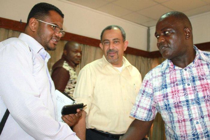 Mombasa Senator Hassan Omar shakes hands with Nyali MP Hezron Awiti as Jubilee's Suleiman Shahbal looks on at an earlier event.