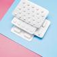 White blister packs with pills on blue and pink background
