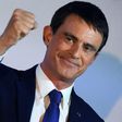 Manuel Valls pumps his fist during a speech after coming he came in second in the first round of the French Socialists' presidential primaries on January 22, 2017 in Paris
