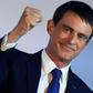 Manuel Valls pumps his fist during a speech after coming he came in second in the first round of the French Socialists' presidential primaries on January 22, 2017 in Paris