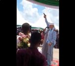 Man said to be Senator Yussuf Haji brandishing a pistol during a public function (Twitter)