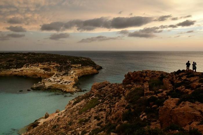 The latest ship carrying rescued migrants took shelter from bad weather off the island of Lampedusa