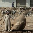 The head of a pharaonic statue that dates back over 3,000 years found in a muddy pit of what is now a sprawling Cairo suburb