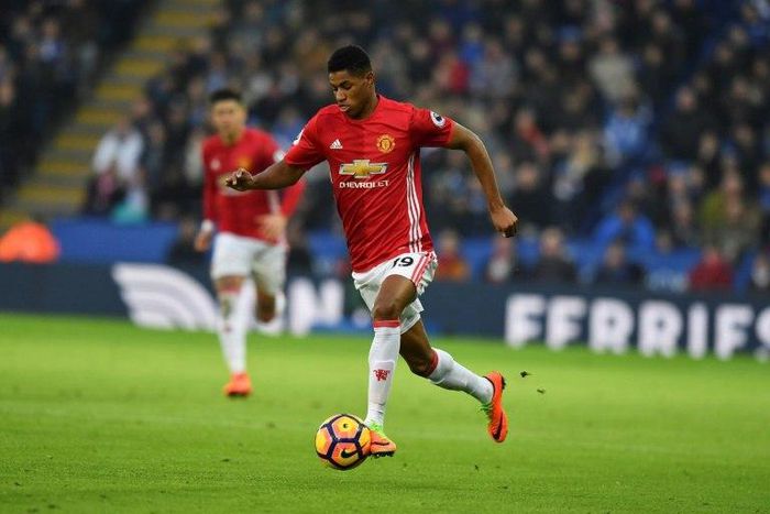 Manchester United's English striker Marcus Rashford runs with the ball during the English Premier League match against Leicester City at King Power Stadium in Leicester on February 5, 2017