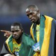Jamaica's Nesta Carter (L), who tested positive for a banned substance, and Usain Bolt (R) were teammates in the men's 4×100m relay final during the 2008 Beijing Olympic Games, where they won gold