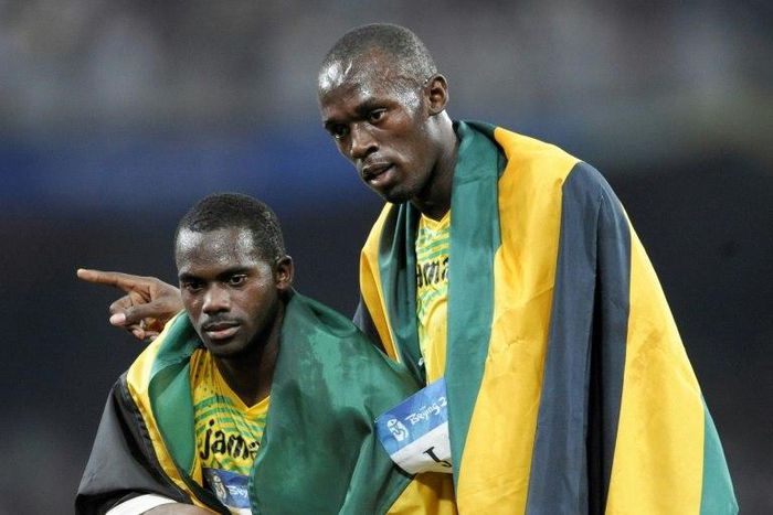 Jamaica's Nesta Carter (L), who tested positive for a banned substance, and Usain Bolt (R) were teammates in the men's 4×100m relay final during the 2008 Beijing Olympic Games, where they won gold