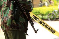 A police officer at a crime scene. Body of Egerton University 5th year engineering student David Ongeri found in his room with deep cuts