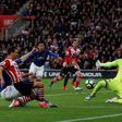 Southampton's defender Cedric Soares (L) shoots but doesn't score as Manchester United's goalkeeper Sergio Romero (R) defends during the English Premier League football match May 17, 2017