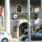 A Turkish policeman stands guard at the Sur municipality building during a police operation