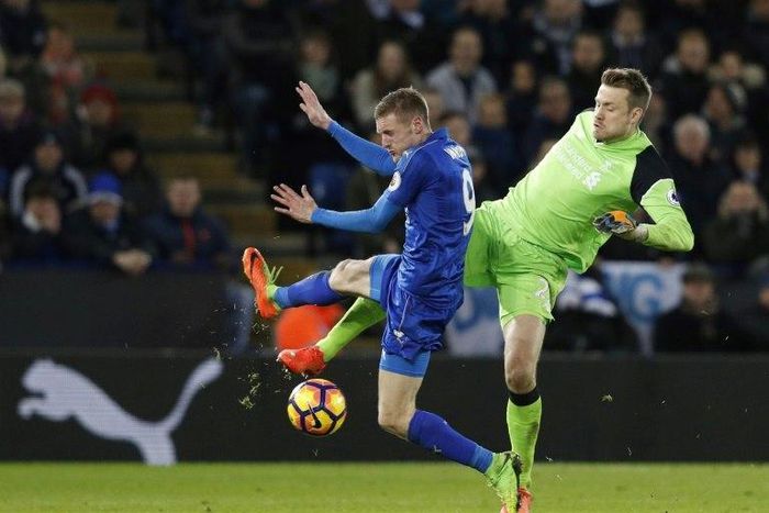 Liverpool's goalkeeper Simon Mignolet (R) clashes with Leicester City's striker Jamie Vardy at King Power Stadium in Leicester, central England on February 27, 2017