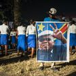 A supporter of the Democratic Republic of Congo's opposition leader Etienne Tshiskedi holds his portrait during a rally in Kinshasa in 2016
