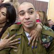 Israeli soldier Elor Azaria is embraced by his mother at the start of his sentencing hearing in a military court in Tel Aviv, on February 21, 2017