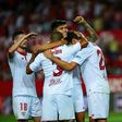 Sevilla's Franco Vazquez (C) celebrates with teammates after scoring a goal during the Spanish league football match against CA Osasuna on May 20, 2017