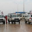 Staff of the Syrian Red Crescent wait on a road in December 2016 for evacuees from Fuaa and Kafraya, two Shiite-majority villages in northwestern Syria that are under siege by the Sunni Muslim rebels