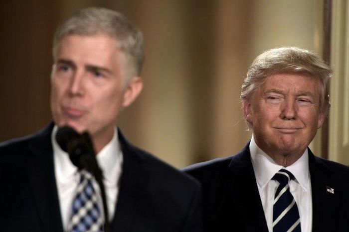 Judge Neil Gorsuch (L) speaks, after US President Donald Trump nominated him for the Supreme Court, at the White House on January 31, 2017