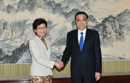 Hong Kong chief executive-elect Carrie Lam (left) shakes hands with Chinese Premier Li Keqiang ahead of talks in Beijing, on April 11, 2017