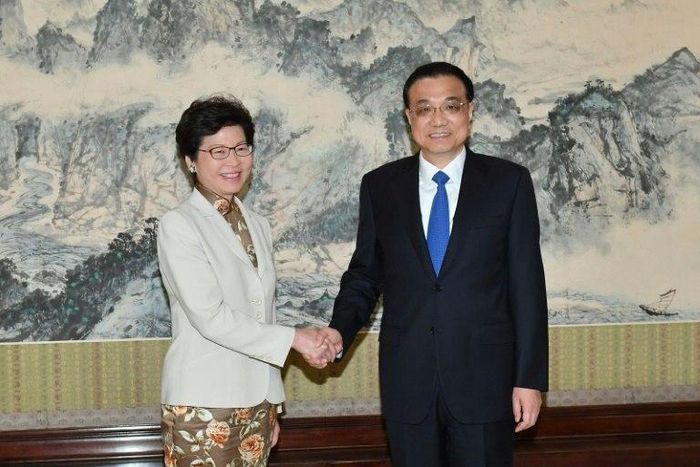 Hong Kong chief executive-elect Carrie Lam (left) shakes hands with Chinese Premier Li Keqiang ahead of talks in Beijing, on April 11, 2017