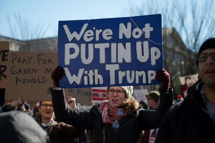 People protest outside the White House on February 4, 2017