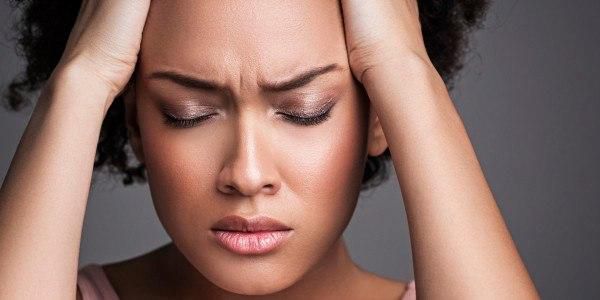 Woman with a headache (Courtesy)
