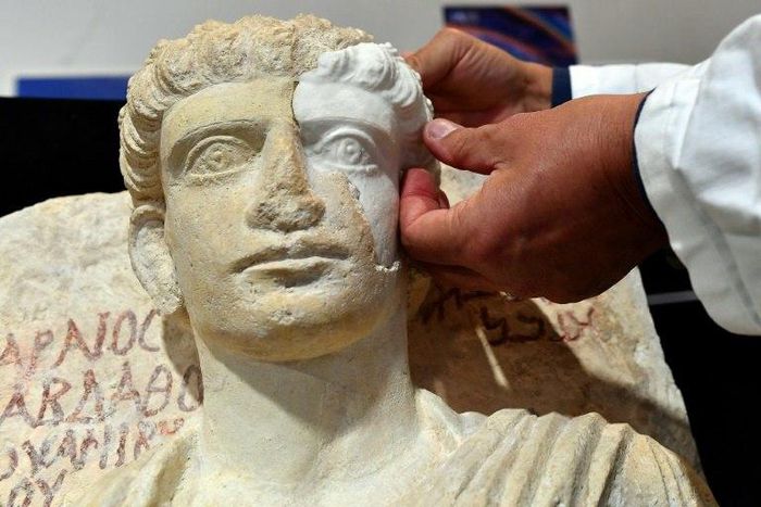 A male bust rescued from the Islamic State group in the Syrian city of Palmyra is restored in Rome in February 2017