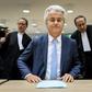 Geert Wilders (C) of the Party for Freedom (PVV) awaits a verdict on charges of insulting a racial group and inciting racial hatred