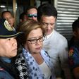 Philippine Senator Leila De Lima (C), a top critic of President Rodrigo Duterte, is escorted by police officers and her lawyer Alex Padilla (R) after her arrest at the Senate in Manila on February 24, 2017