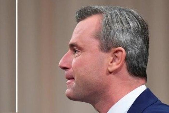 Alexander Van der Bellen (L) candidate for presidential elections of the Austrian Greens and Norbert Hofer (R), candidate of Austria's right-wing Freedom Party, FPOE, speaking to each other during a television debate on November 27, 2016