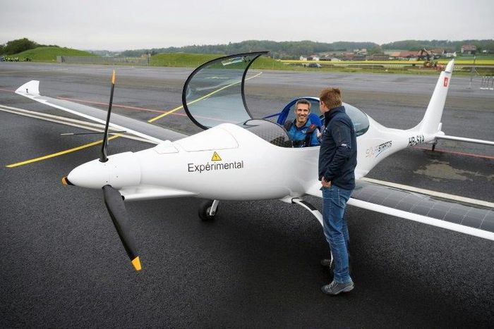 Raphael Domjan, who initiated the SolarStratos project, shakes hands with pilot Damian Hischier after the first test flight in Payerne, Switzerland