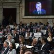 Opposition legislators hold banners as they listen to the speech of Argentina's President Mauricio Macri during the inauguration of the 135th period of ordinary sessions at the Congress in Buenos Aires on March 1, 2017