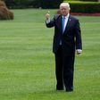 US President Donald Trump (R) gives a thumbs up as he and First Lady Melania Trump (L) depart the White House on this first foreign trip