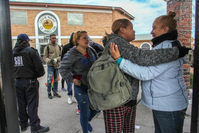 Cuban and Central American migrants leave the Casa del Migrante shelter in Ciudad Juarez, Mexico, before heading to the border to request political asylum in the United States