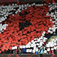 Fans form a poppy mosaic in memory of Britain's war dead ahead of the World Cup 2018 qualification match between Wales and Serbia at Cardiff City stadium in Cardiff on November 12, 2016