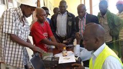 An Independent Electoral and Boundaries Commission official registers voters in Eldoret town.