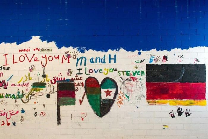 Wall Paintings are pictured at the empty refugee reception center in Niederau, eastern Germany, on September 22, 2016
