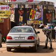 Police officers check cars at the entrance to the Pan-African Film and Television Festival (FESPACO) in Ouagadougou