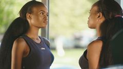 Woman looking at herself in the mirror(Video Blocks)