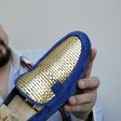 Antonio Vietri's gold shoes sell for up to 30,000 euros a pair