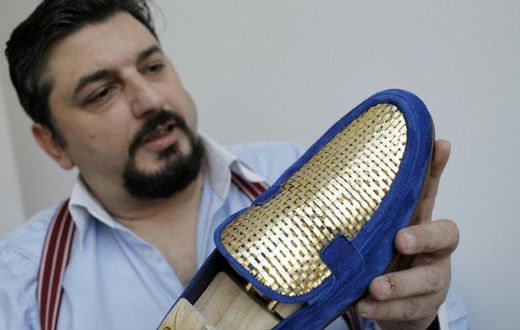 Antonio Vietri's gold shoes sell for up to 30,000 euros a pair